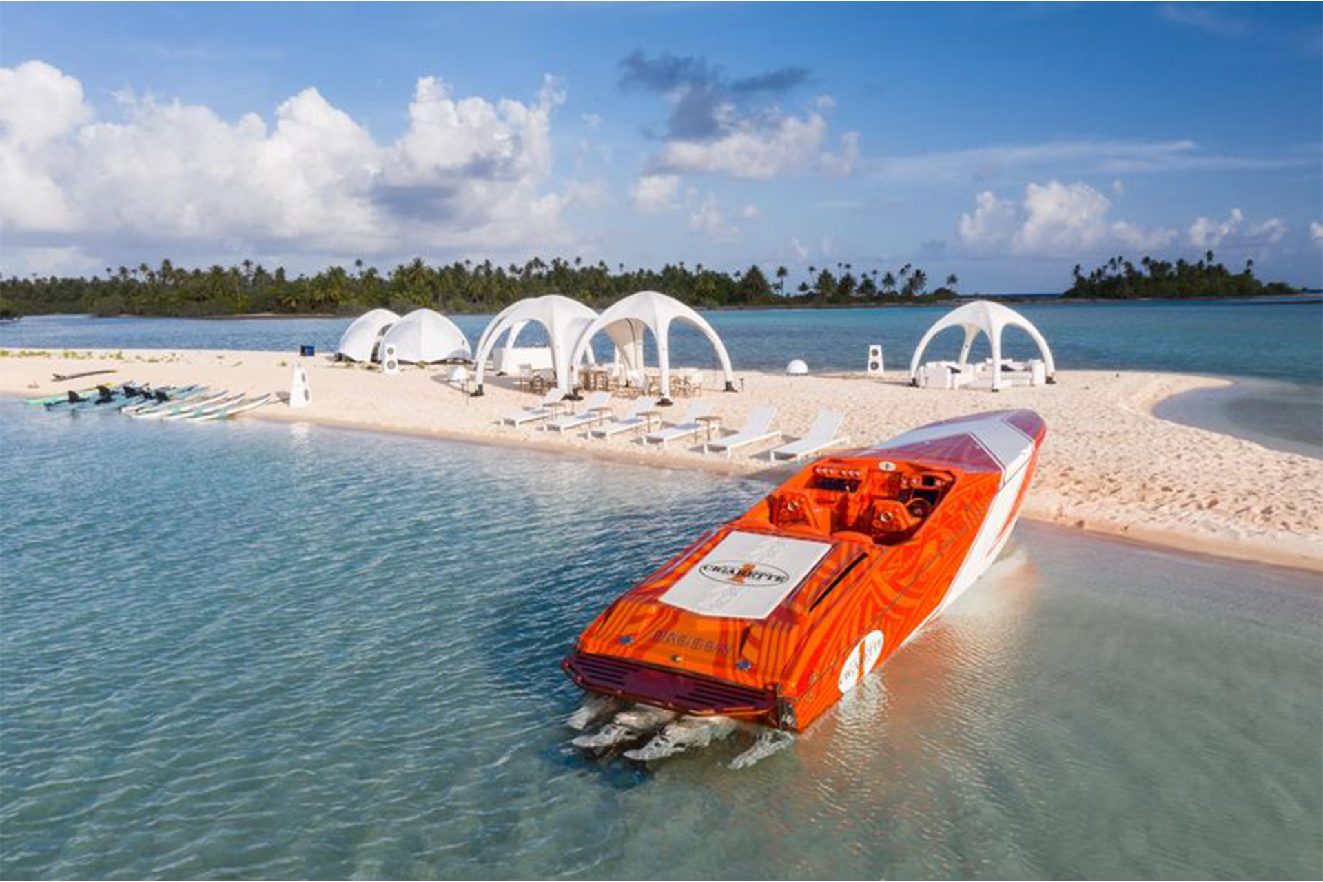 Custom boat parked in front of beach.