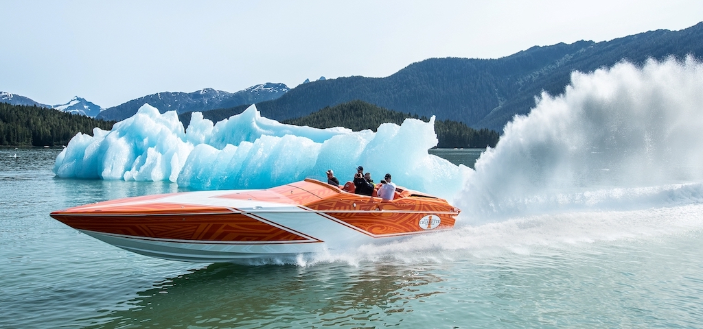 Custom boat speeding out in water